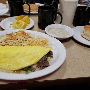 an omelet and biscuits on a table