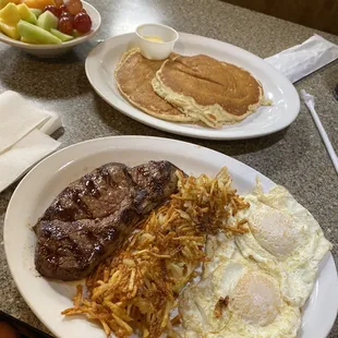 Steak &amp; eggs with pancakes / fruit