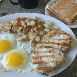 Grilled chicken, eggs, ss up home fries, dry white toast.