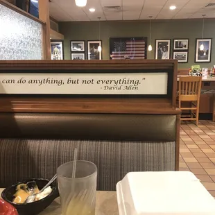 a table with a bowl of soup and a sign that says you can do anything, but not everything