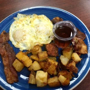 This TOO: 2 pancakes, 2 eggs, 2 pieces of crispy bacon and amazing home fries..for $4.99!!