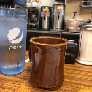 a glass of water and a cup of ice