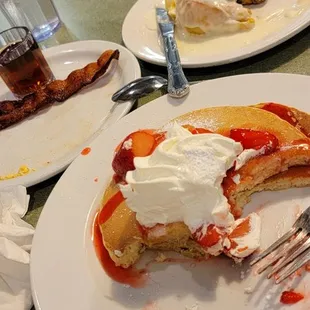 Strawberry pancakes breakfast special combo with 2 bacon, 2 eggs ($10.99) with side of cinnamon roll ($5)!
