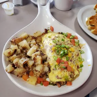 Meat omlette with country potatoes