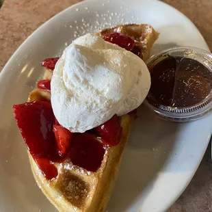 Half a waffle with strawberries