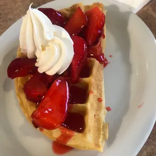 Half order of waffle with strawberry topping, just like the menu shows it.