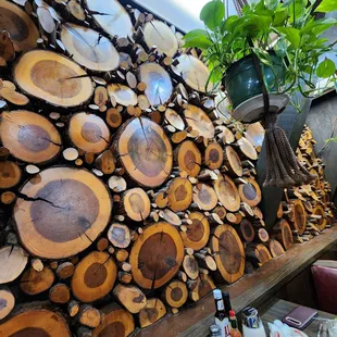 Log slices on wall decor beside our table