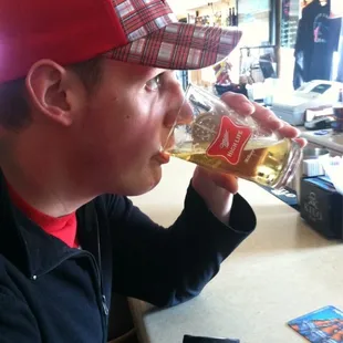 a man drinking a beer