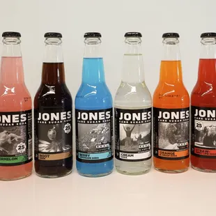 a row of bottles of soda