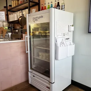 Freezer with ice cream cookies sandwiches.