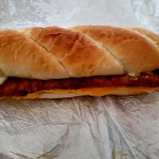 a sandwich with meat and cheese