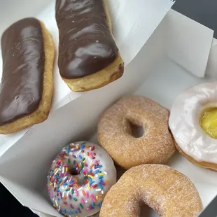 Chocolate bar, sugar donut, sprinkle donut, &amp; lemon filled glazed donut