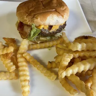 Bacon cheeseburger with fries.