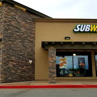 the entrance to a subway restaurant