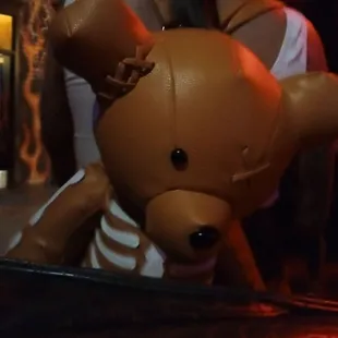 a fake teddy bear in the dark