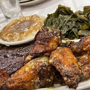 Combo 2 pick St. Louis ribs and smoked wings (spicy garlic park) w/ seasoned collards and mashed potatoes &amp; gravy)