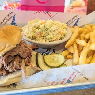 Pulled Pork Sandwich with coleslaw and fries