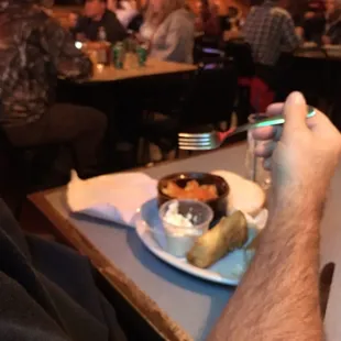 a man taking a picture of a dessert