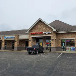 a truck parked in front of the store