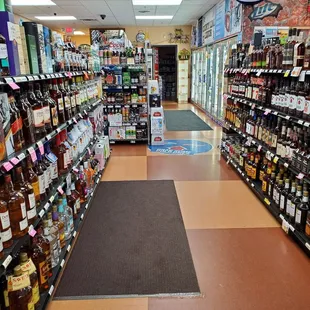 a wide aisle of liquor