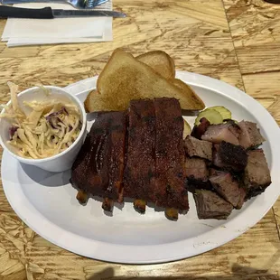 Baby back ribs, burnt ends, coleslaw, toast and pickles.