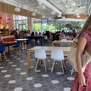 a woman standing in a restaurant