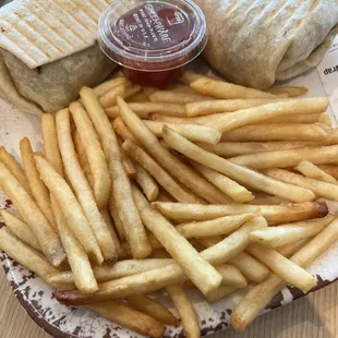 Veggie crunch wrap with a side of fries