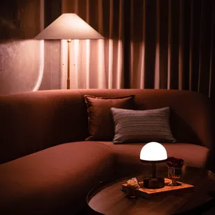 a couch and a table in a dimly lit room