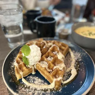 Sweet potato waffles and savory grits with coffee and water