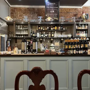 a bar with shelves of liquor