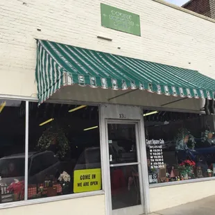 Look for the green awning.