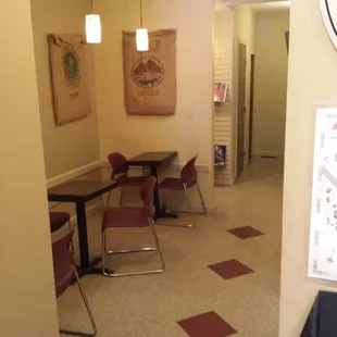 a table and chairs in a coffeehouse