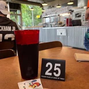 Inside sitting at a table!