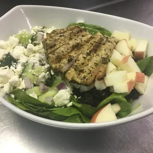 Our seasonal salad includes grilled chicken, cucumbers, red onion, feta, cranberries, and apples.