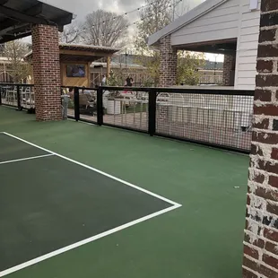 a tennis court in a residential area