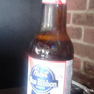 a bottle of beer on a table
