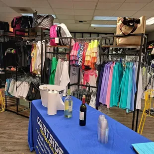 Clothing and wine table set up for Pre-Black Friday sale