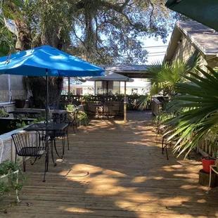 patio area with tables and umbrellas