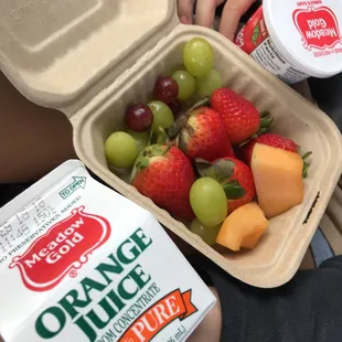Fruits from the salad bar with yogurt and OJ