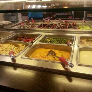 a buffet with a variety of food items