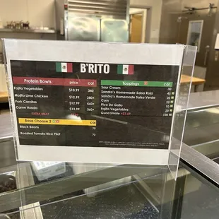 a menu on a glass counter