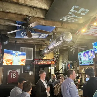 a group of people at a bar