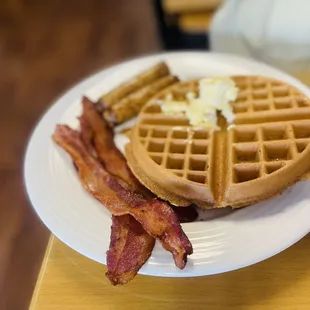 a waffle and bacon on a plate