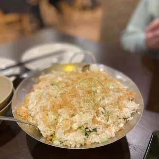 a plate of fried rice and a bowl of soup