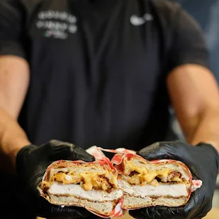 a man holding a sandwich