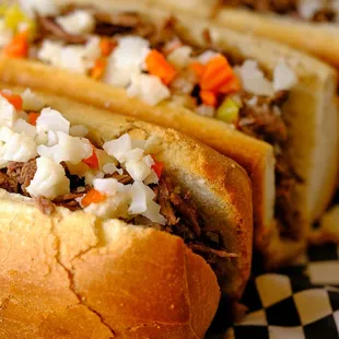 a close up of two hot dogs