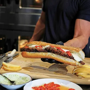 a man preparing a sandwich