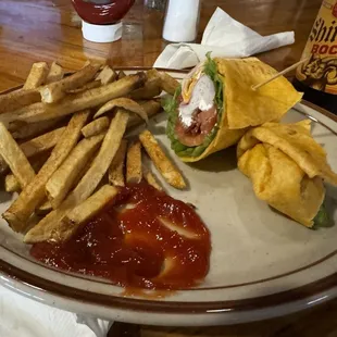 I forgot and ate half the wrap before getting photo, but this is the deli wrap with fries! It was great and prices are reasonable