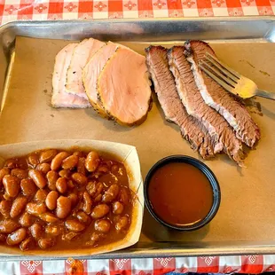 ows a tray of barbecue food