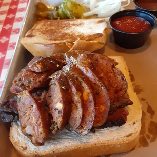 Brisket and jalapeno cheddar sausage sandwich